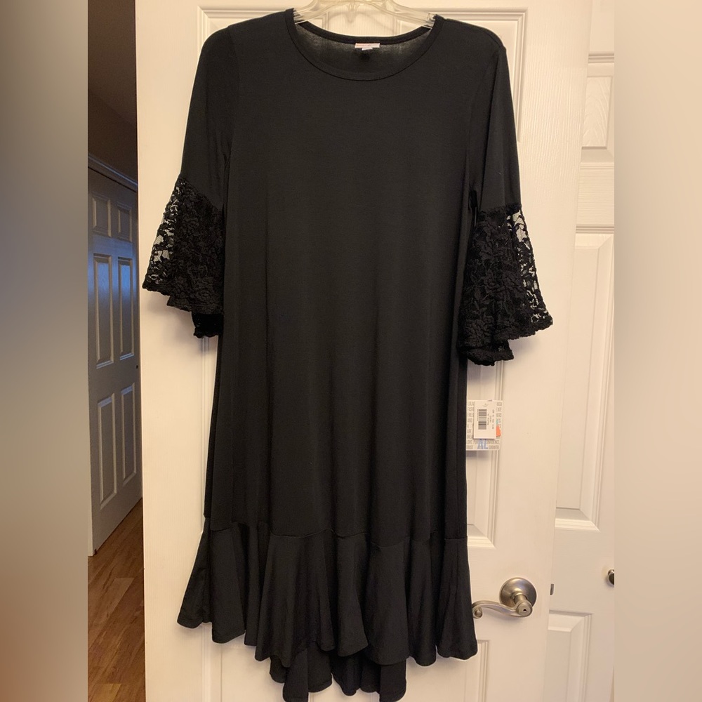 NWT black Maureen dress with lace sleeves.